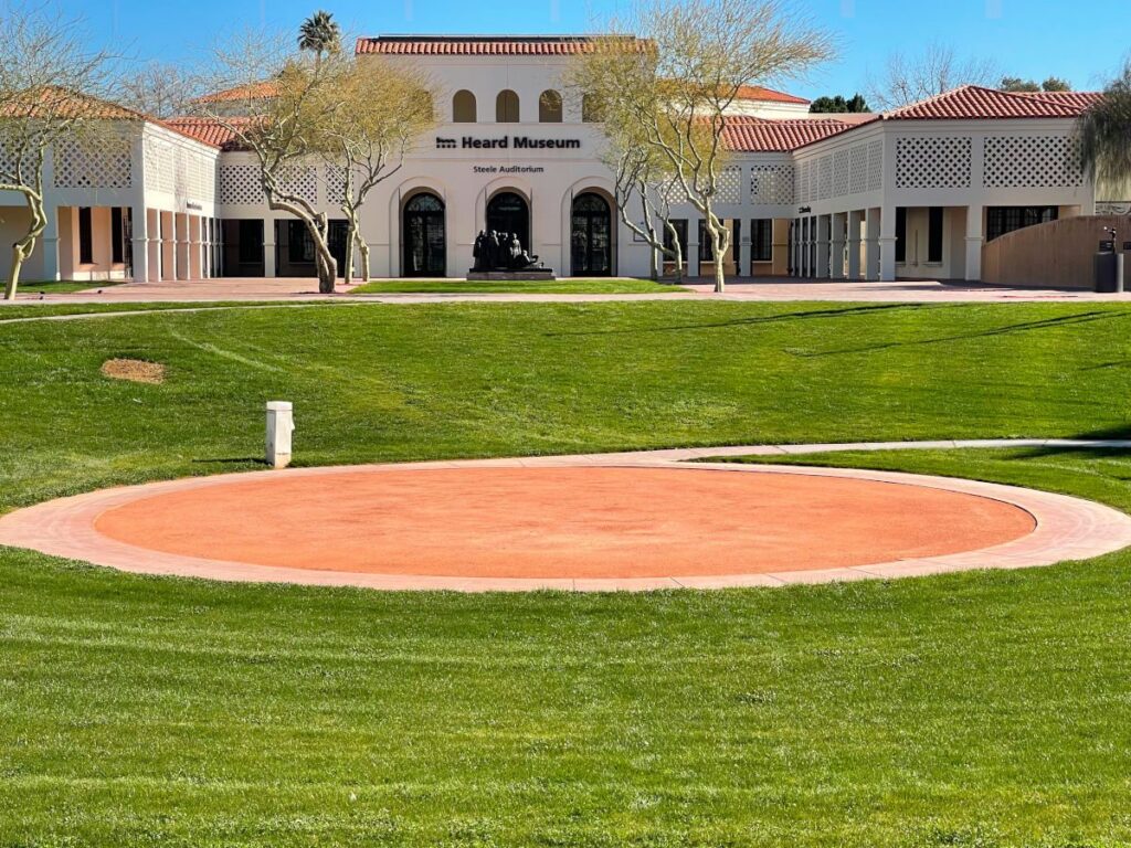 The Heard Museum's white arcaded buildings and lawn around a circular dance ground in Phoenix
