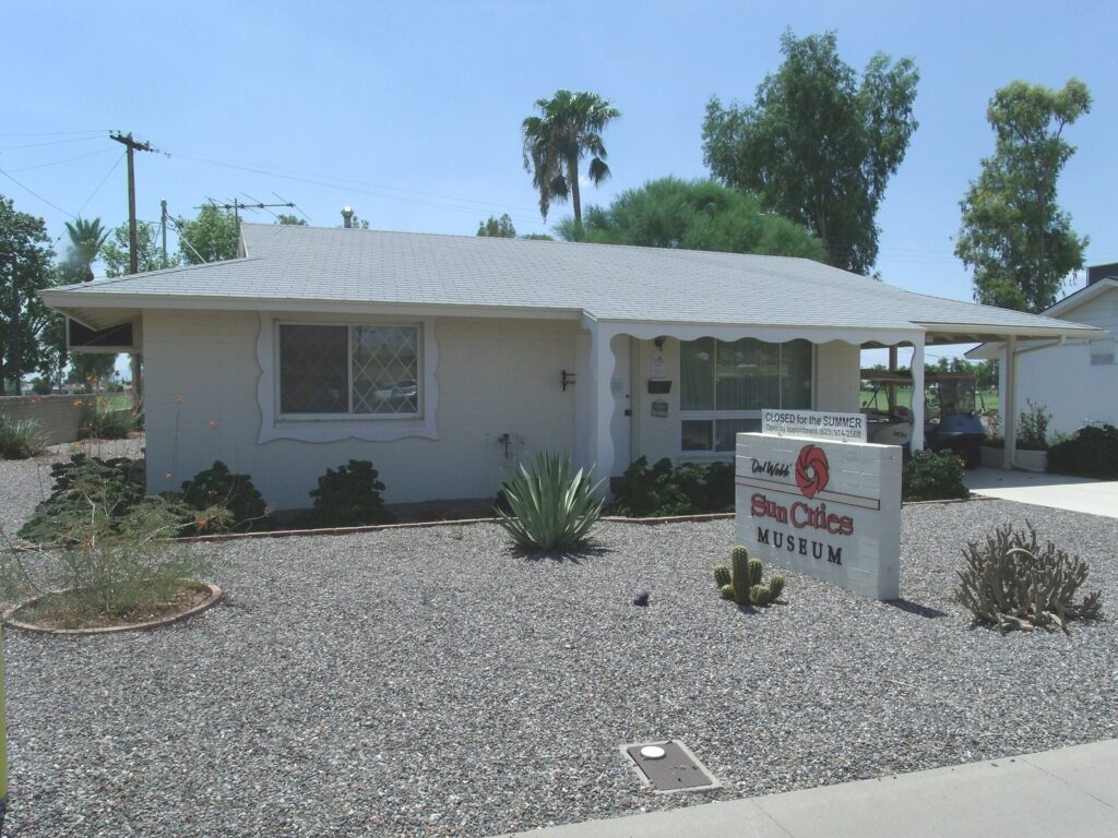 A small white 1959 model home with a gravel front yard and desert plants, now the Sun Cities Museum in Sun City, Arizona
