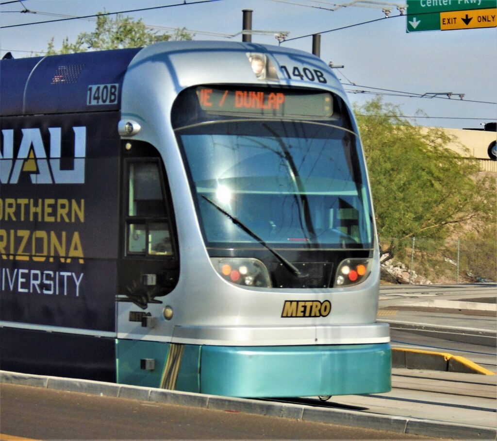 A silver Valley Metro light-rail train on East Washington Street, the line that shapes where to stay in Phoenix without a car