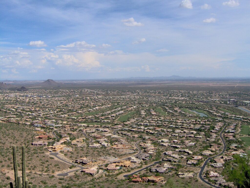 Homes and golf fairways below a hillside in north Scottsdale, one of the priciest areas for monthly rentals Phoenix AZ