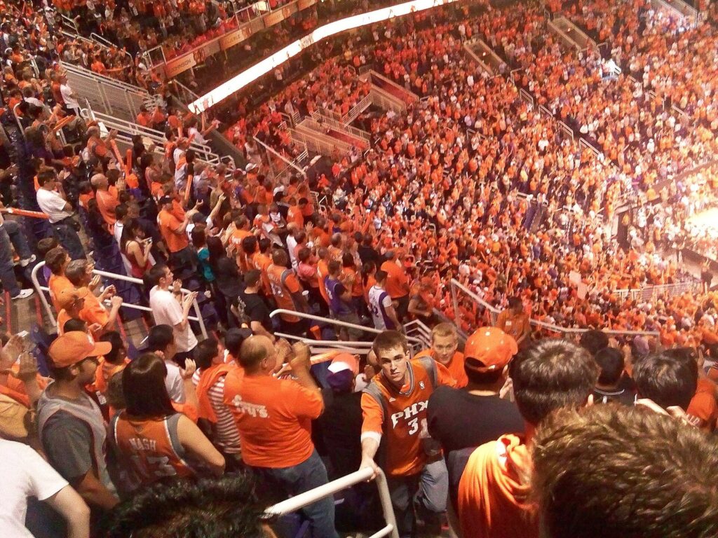Phoenix Suns fans dressed in orange packing the stands during a playoff game